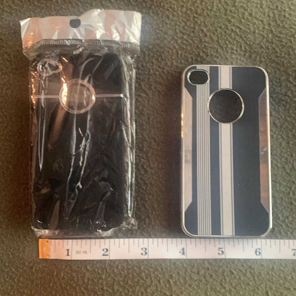 NIP black and silver phone cover and one GUC black and silver phone cover.